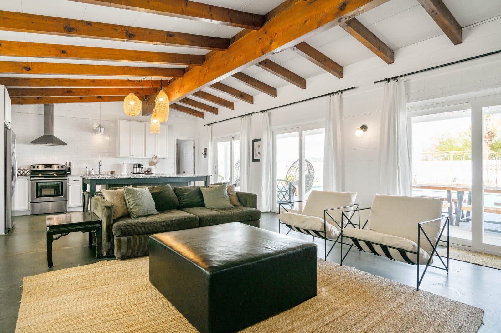 Wonder Valley Ranch — open-plan living room with exposed beams
